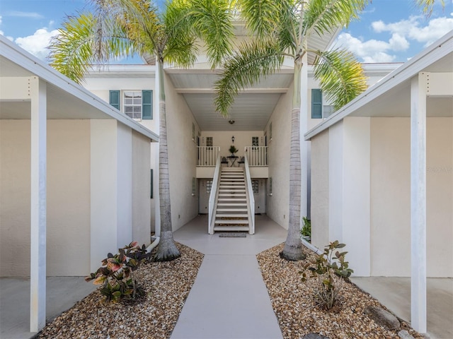 view of exterior entry featuring stucco siding