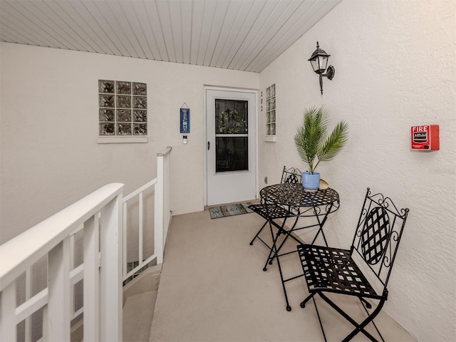 property entrance featuring stucco siding