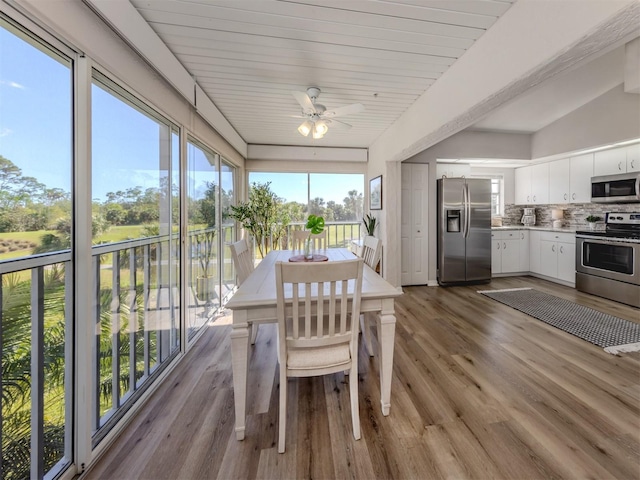 interior space with ceiling fan