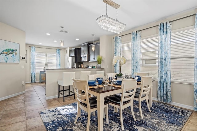 dining room with light tile patterned floors, baseboards, visible vents, and recessed lighting