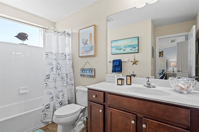 full bathroom with shower / bath combination with curtain, visible vents, vanity, and toilet