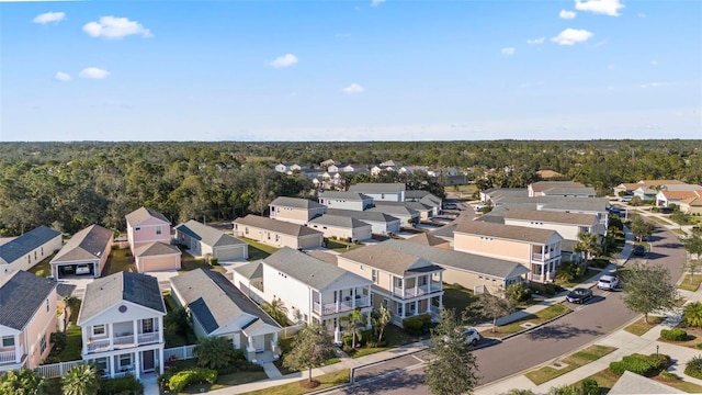 birds eye view of property with a forest view and a residential view