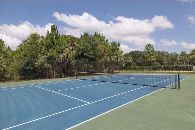 view of tennis court with fence