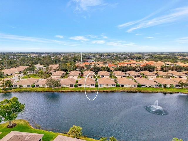 birds eye view of property featuring a water view and a residential view