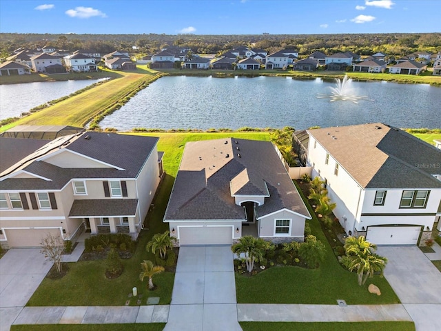 birds eye view of property featuring a water view and a residential view