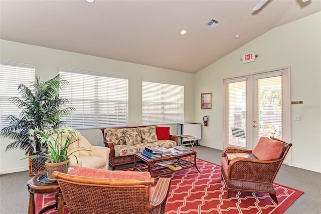 living room with lofted ceiling, french doors, carpet flooring, and visible vents