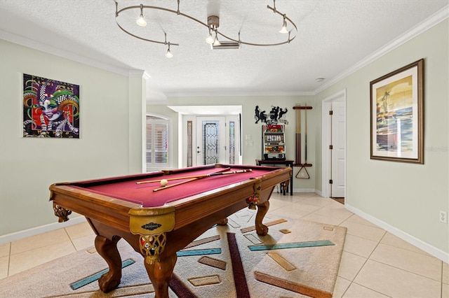 game room featuring light tile patterned floors, a textured ceiling, baseboards, and crown molding