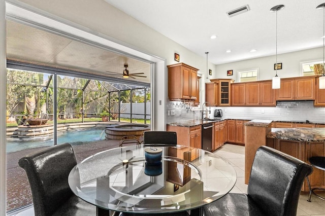 dining room featuring a sunroom, recessed lighting, visible vents, and light tile patterned flooring