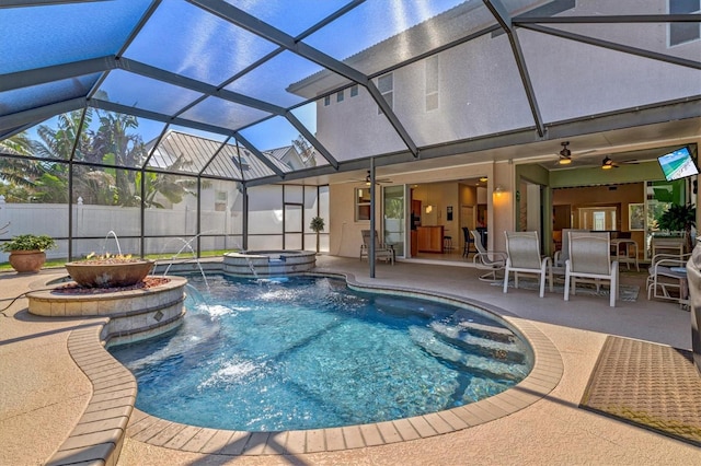 view of swimming pool with a patio, ceiling fan, fence, outdoor dining area, and a pool with connected hot tub