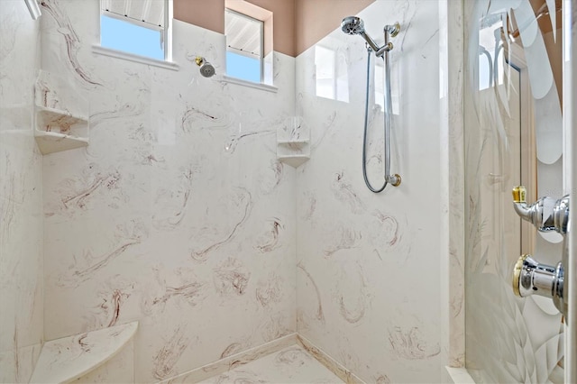 full bath with a marble finish shower