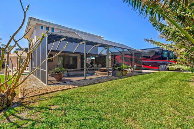 rear view of house featuring a patio area, glass enclosure, an outdoor pool, and a lawn