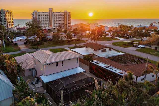 aerial view at dusk with a water view