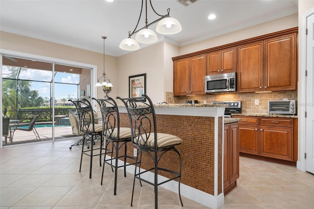 kitchen with appliances with stainless steel finishes, brown cabinetry, ornamental molding, and backsplash