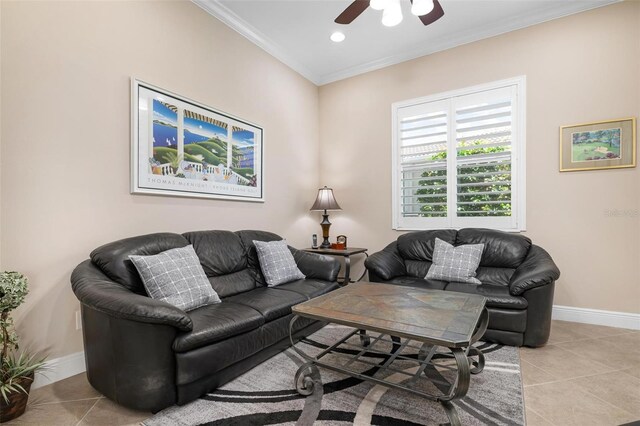 living area with ornamental molding, baseboards, and light tile patterned floors