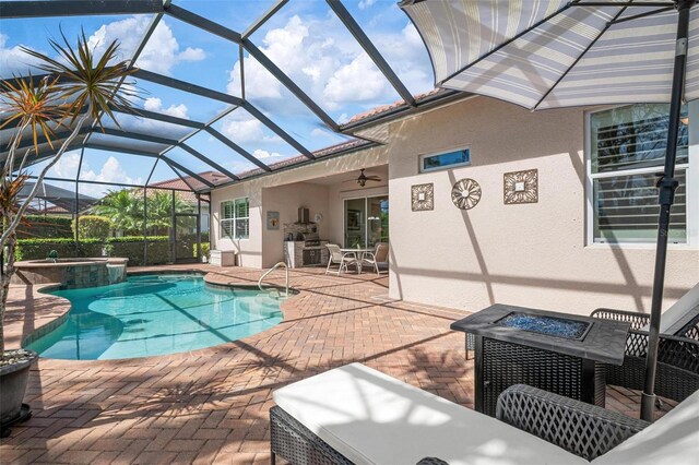 outdoor pool featuring ceiling fan, a lanai, a fire pit, an in ground hot tub, and a patio area