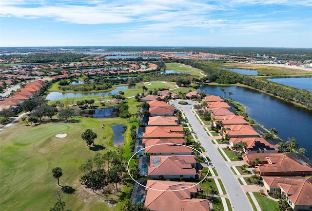 bird's eye view with view of golf course, a water view, and a residential view