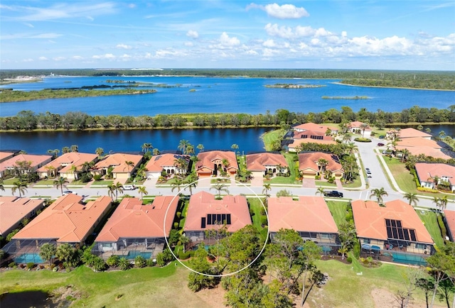 aerial view featuring a residential view and a water view