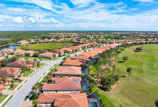 bird's eye view featuring a water view and a residential view