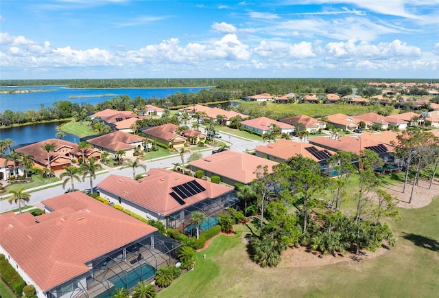 bird's eye view featuring a residential view and a water view