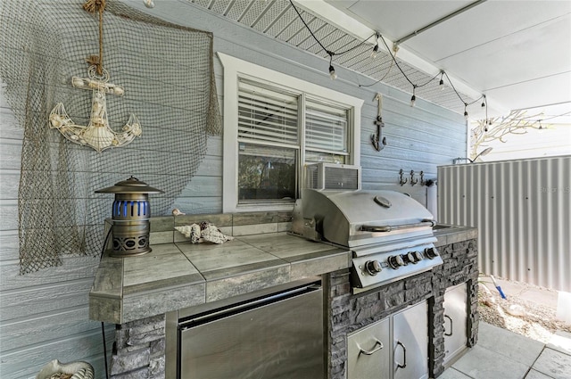 view of patio / terrace with exterior kitchen and area for grilling