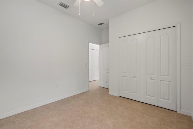 unfurnished bedroom with a ceiling fan, a closet, visible vents, and baseboards