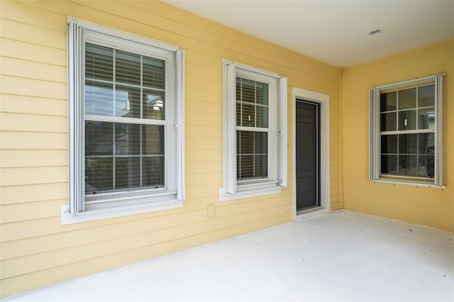 entrance to property featuring a patio