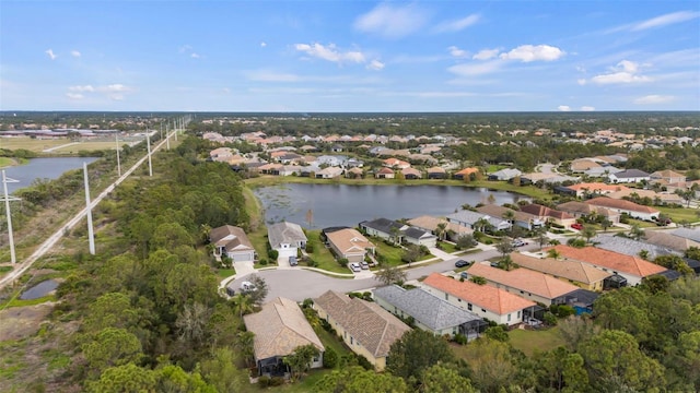 aerial view featuring a water view and a residential view