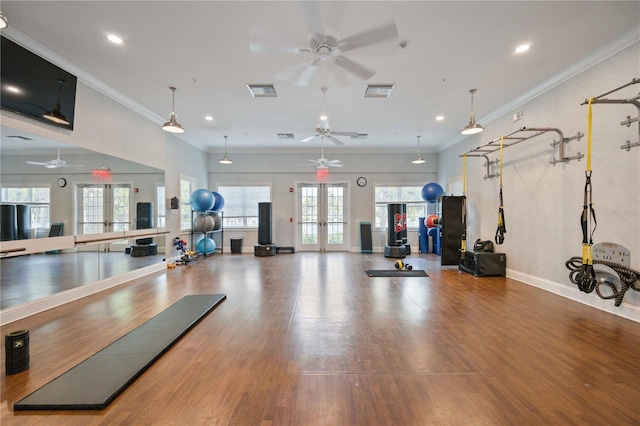 gym with ornamental molding, french doors, wood finished floors, and visible vents