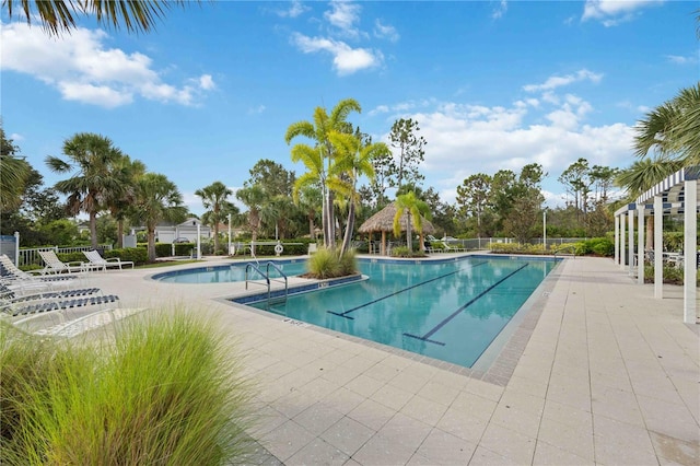 pool with a patio and a gazebo