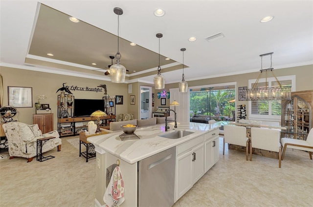 kitchen featuring a raised ceiling, visible vents, open floor plan, a sink, and dishwasher