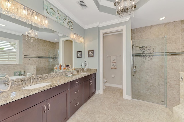 bathroom with a stall shower, ornamental molding, a chandelier, and a sink