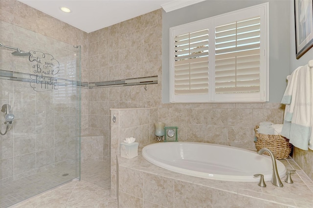 bathroom featuring a garden tub and a walk in shower