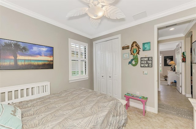 bedroom with light carpet, a closet, visible vents, and crown molding