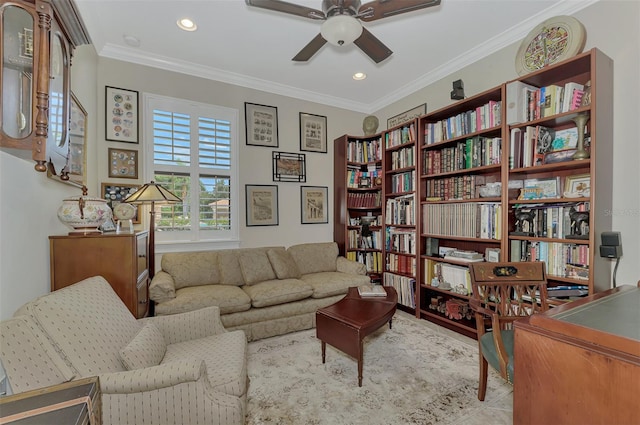 sitting room with ceiling fan, recessed lighting, and crown molding