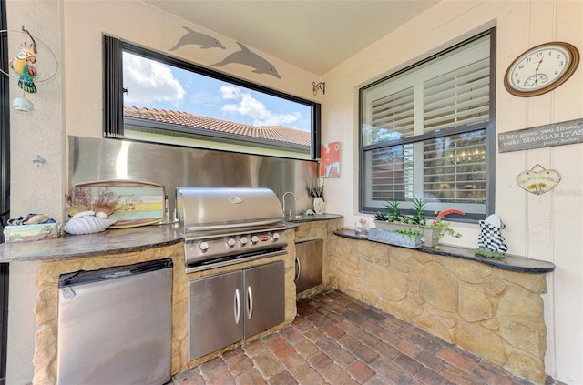 view of patio with exterior kitchen and area for grilling