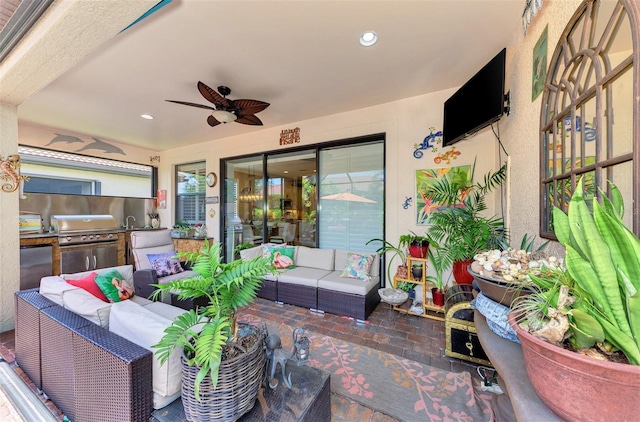 view of patio with an outdoor hangout area, area for grilling, and a ceiling fan