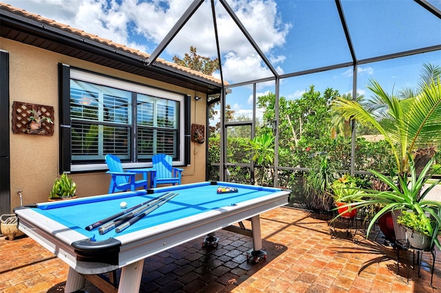 view of patio / terrace featuring a lanai