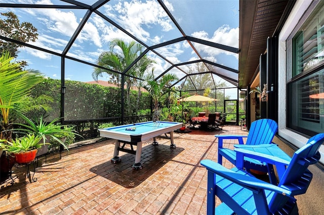 view of patio with glass enclosure