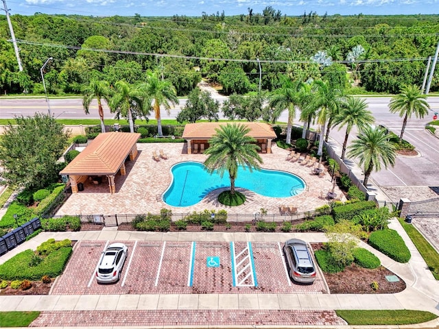 birds eye view of property featuring a wooded view