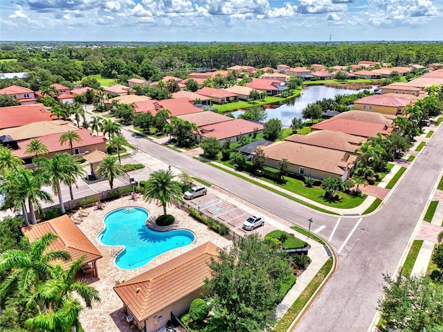 bird's eye view featuring a residential view and a water view