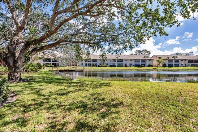 view of yard with a water view and a residential view