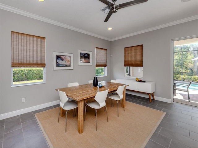 dining space featuring crown molding, dark tile patterned floors, recessed lighting, and baseboards