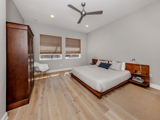 bedroom with light wood-type flooring, ceiling fan, baseboards, and recessed lighting