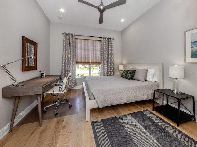 bedroom with lofted ceiling, baseboards, wood finished floors, and recessed lighting