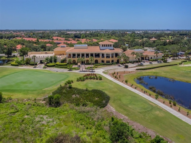 aerial view with view of golf course and a water view