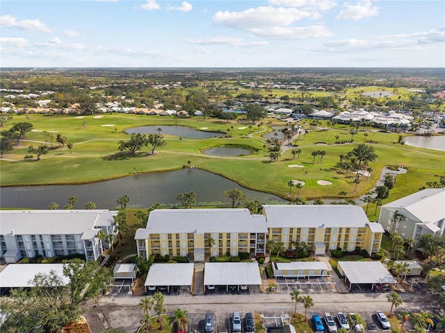 bird's eye view with a water view and golf course view