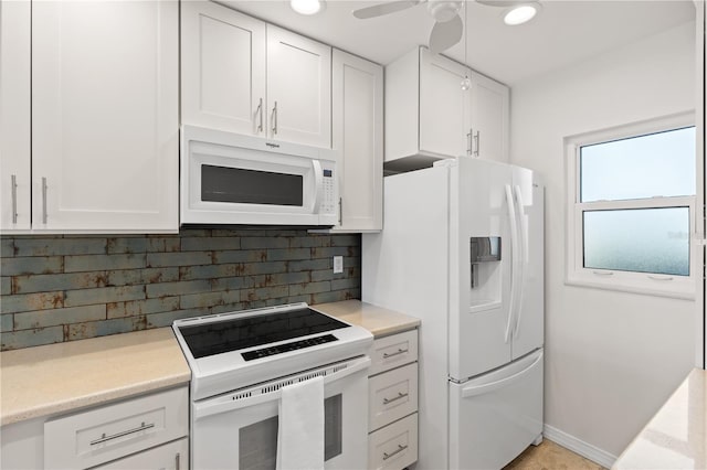 kitchen featuring ceiling fan, white appliances, white cabinets, light countertops, and decorative backsplash