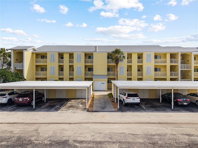 view of building exterior featuring covered parking