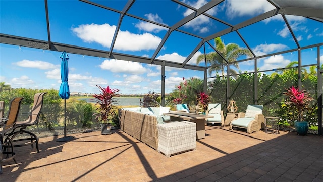 view of patio / terrace with glass enclosure and an outdoor living space