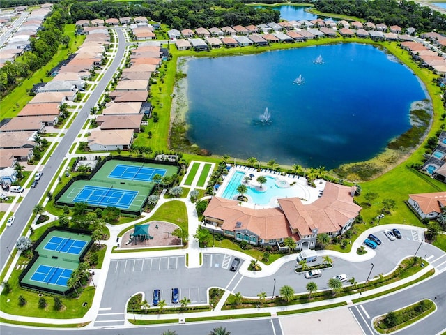 drone / aerial view featuring a water view and a residential view